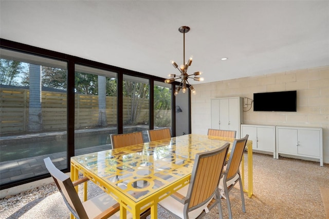 dining space with a chandelier