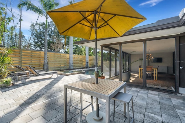 view of patio / terrace with a fenced in pool