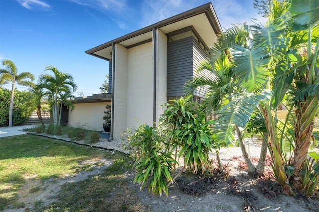 view of home's exterior featuring a yard