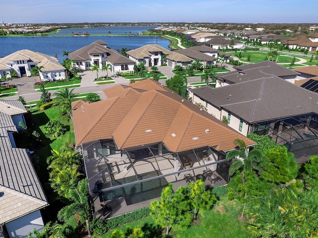 aerial view with a water view and a residential view