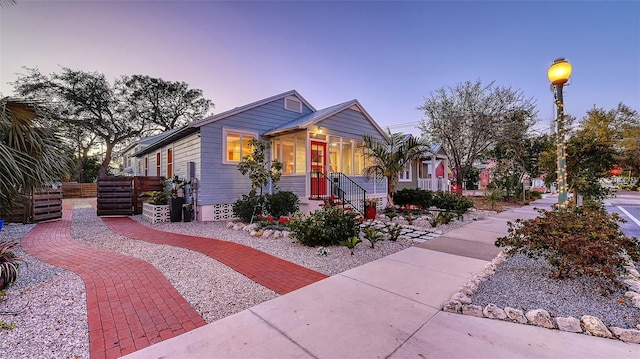 view of front of house featuring fence