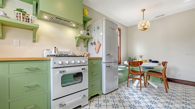 kitchen featuring white appliances, visible vents, green cabinets, premium range hood, and open shelves