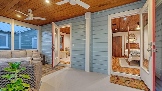 interior space featuring wooden ceiling and ceiling fan