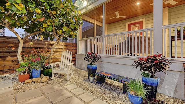 view of patio / terrace featuring ceiling fan and fence