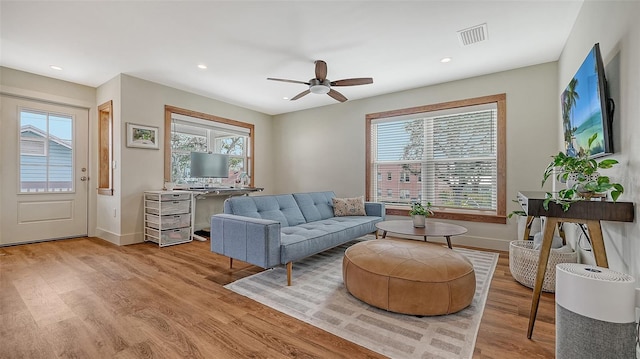 sitting room featuring baseboards, visible vents, wood finished floors, and recessed lighting