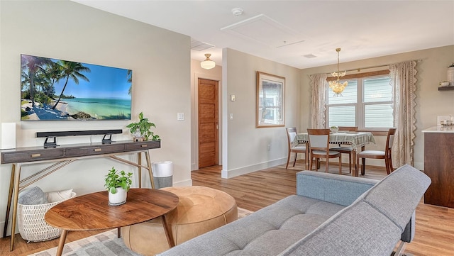 living area with wood finished floors and baseboards