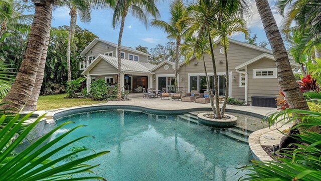 view of swimming pool featuring a patio area