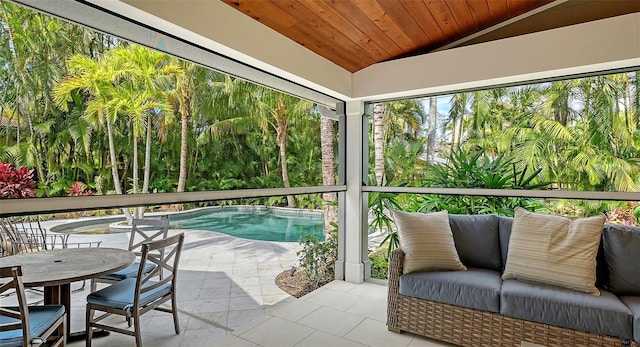 sunroom with lofted ceiling and wooden ceiling