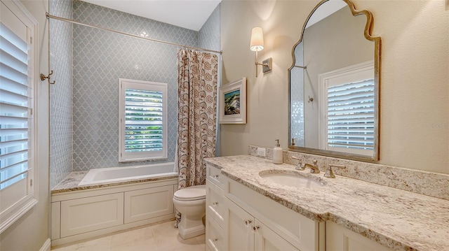 bathroom with vanity, tile patterned floors, and toilet