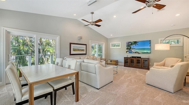 carpeted living room with high vaulted ceiling and ceiling fan