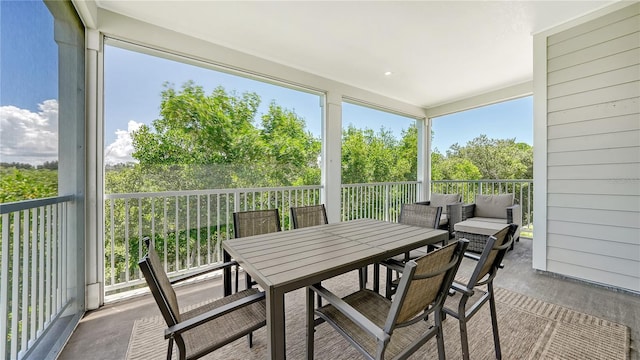 sunroom / solarium with outdoor dining area
