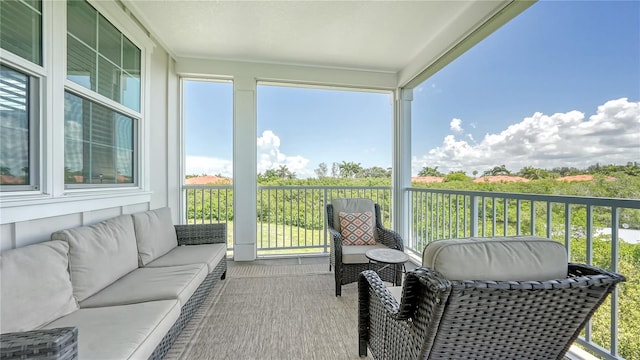 sunroom with an outdoor hangout area
