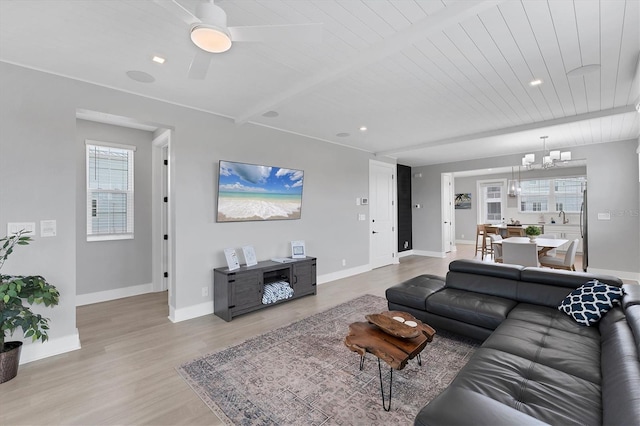 4207 Marina View Way, Cortez, FL 34215 - living room with a chandelier, wood ceiling, light wood finished floors, and a ceiling fan