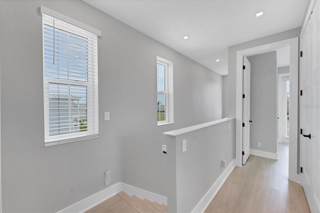 4207 Marina View Way, Cortez, FL 34215 - hall with healthy amount of natural light, light wood-type flooring, and an upstairs landing
