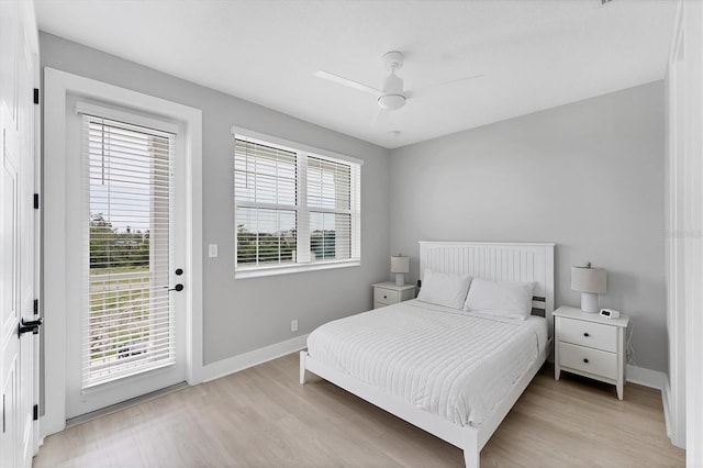 4207 Marina View Way, Cortez, FL 34215 - bedroom featuring multiple windows, access to exterior, and light wood-type flooring