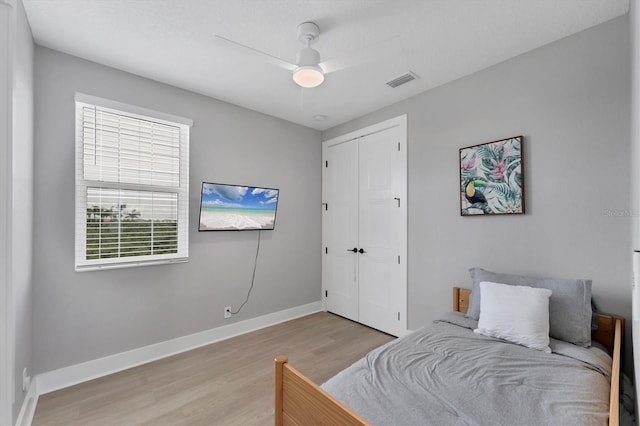 4207 Marina View Way, Cortez, FL 34215 - bedroom with light wood-style flooring, a closet, and ceiling fan