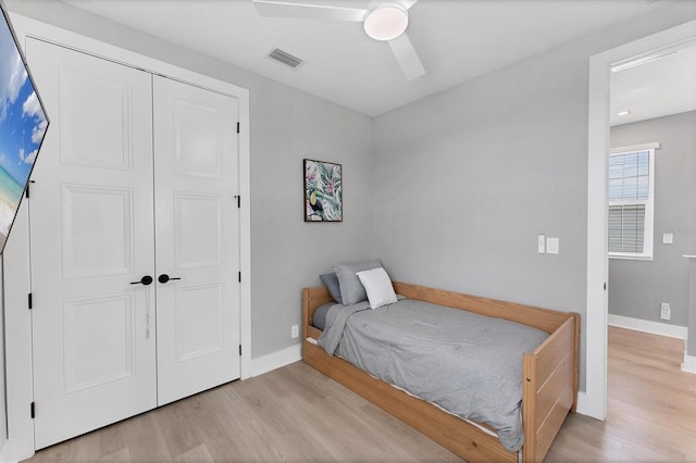 4207 Marina View Way, Cortez, FL 34215 - bedroom featuring wood finished floors, a closet, and a ceiling fan