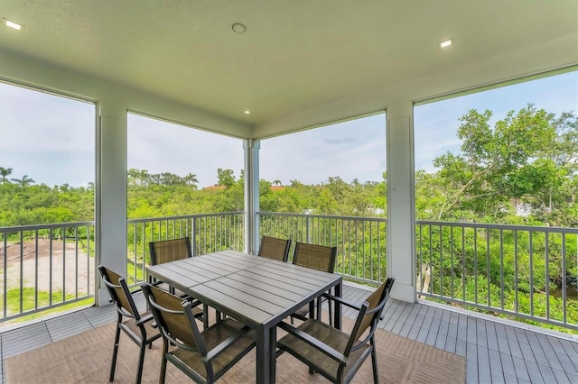 4207 Marina View Way, Cortez, FL 34215 - sunroom with healthy amount of natural light, a view of trees, and outdoor dining space
