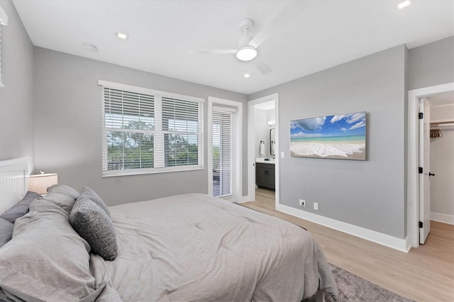 4207 Marina View Way, Cortez, FL 34215 - bedroom featuring light wood finished floors, a walk in closet, ceiling fan, ensuite bathroom, and recessed lighting
