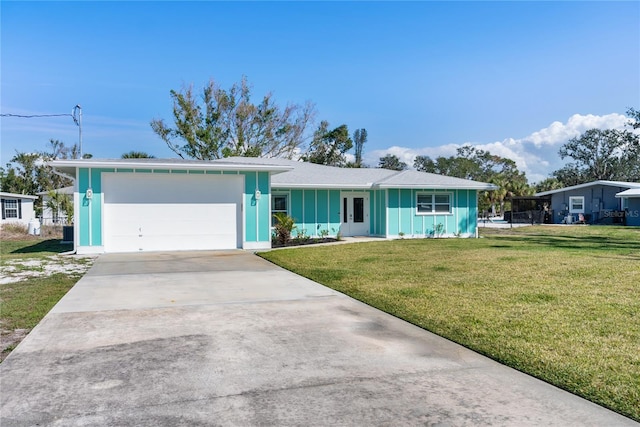 ranch-style home with a garage and a front lawn