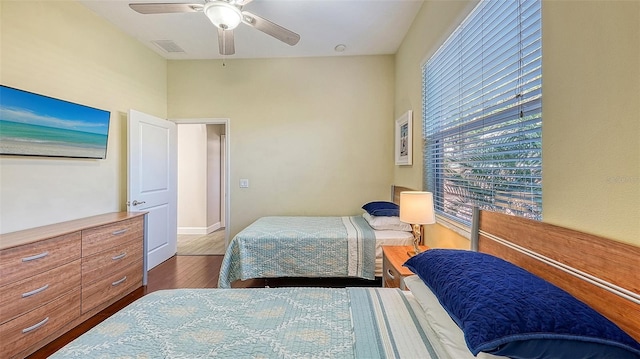 bedroom with wood-type flooring and ceiling fan