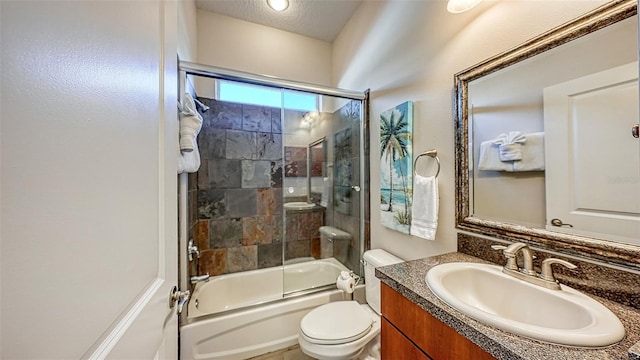 full bathroom with vanity, shower / bath combination with glass door, and toilet