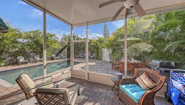 sunroom / solarium with ceiling fan