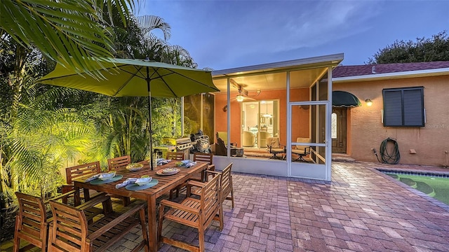 view of patio / terrace with a sunroom