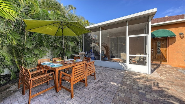 view of patio / terrace with a sunroom