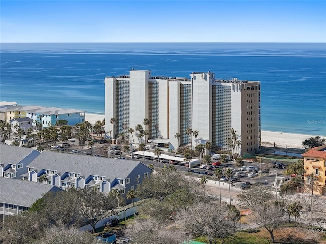 birds eye view of property with a water view and a view of the beach