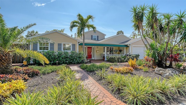 view of front of house with a garage and covered porch