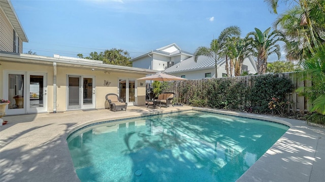 view of swimming pool with a patio