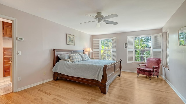 bedroom featuring ceiling fan and light hardwood / wood-style floors