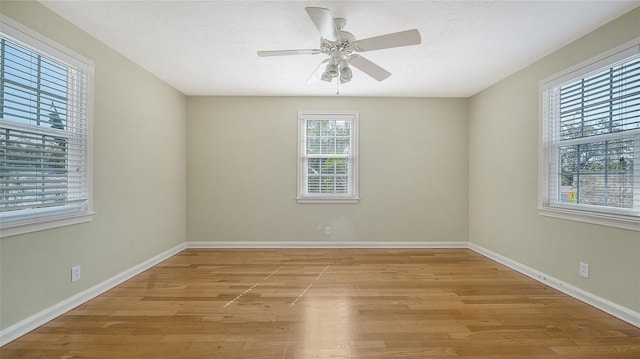 empty room with ceiling fan, light hardwood / wood-style flooring, and a textured ceiling