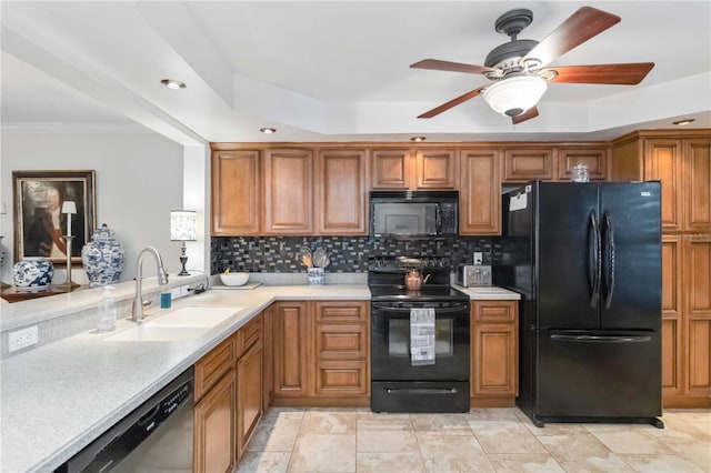 kitchen featuring tasteful backsplash, sink, ornamental molding, ceiling fan, and black appliances