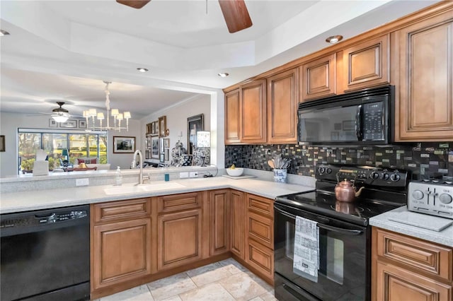 kitchen with ceiling fan with notable chandelier, backsplash, sink, and black appliances