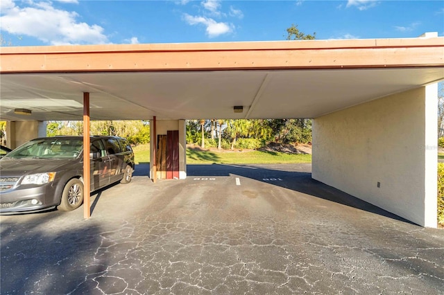 view of car parking featuring a carport