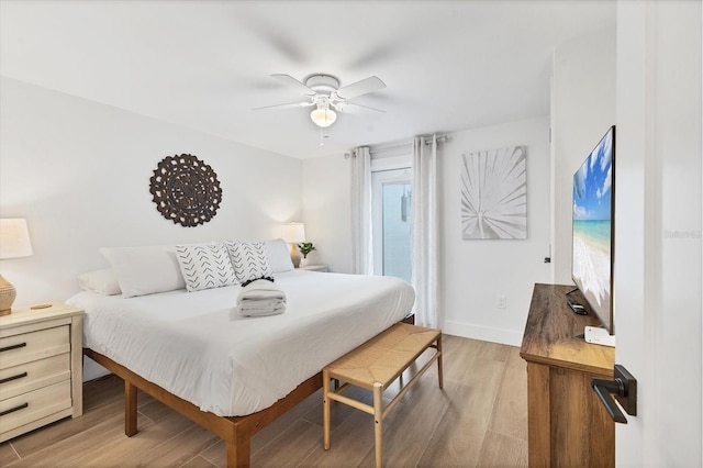 bedroom with ceiling fan and light hardwood / wood-style floors