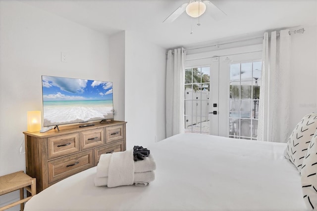 bedroom with access to outside, french doors, and ceiling fan