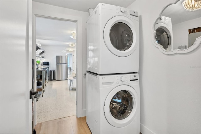 washroom with stacked washer and clothes dryer