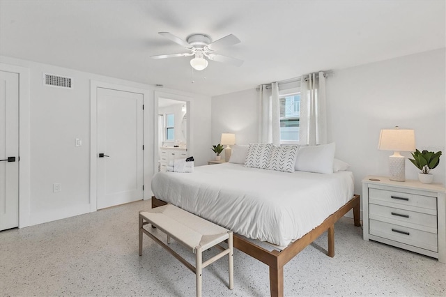 bedroom featuring ensuite bathroom and ceiling fan