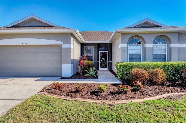 single story home with a garage