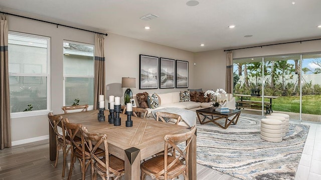 dining room featuring plenty of natural light and hardwood / wood-style floors