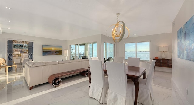 dining area with an inviting chandelier