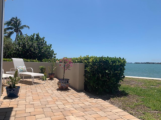 view of patio / terrace featuring a water view