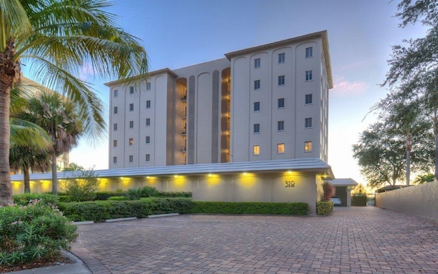 view of outdoor building at dusk