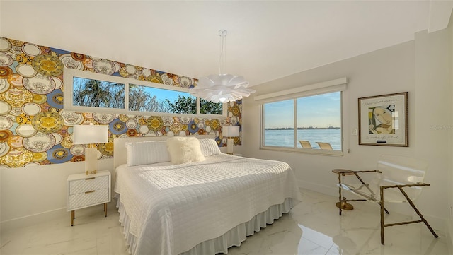 bedroom featuring a water view