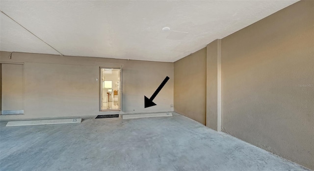 spare room with concrete flooring