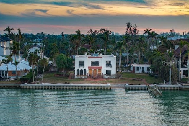 pool at dusk with a water view