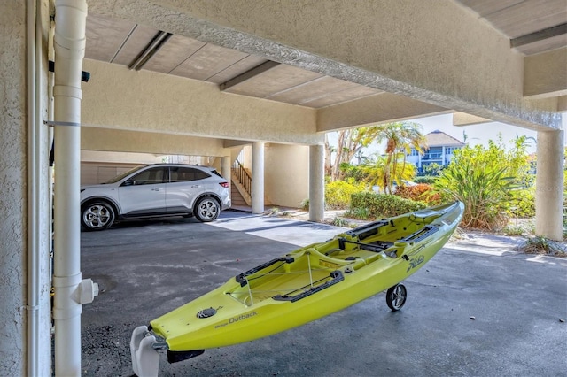 view of parking / parking lot with a carport